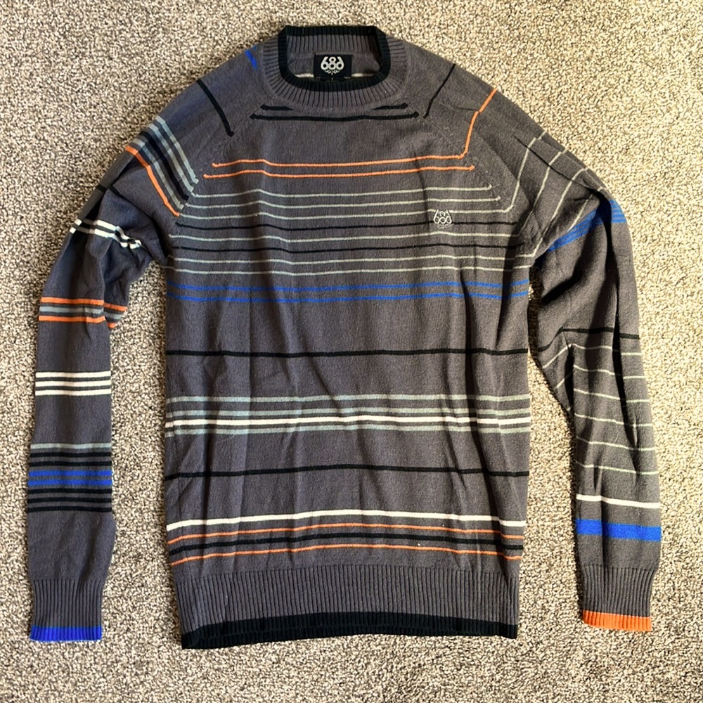 Grey/Multi color 686 sweater in size small. Like new condition.